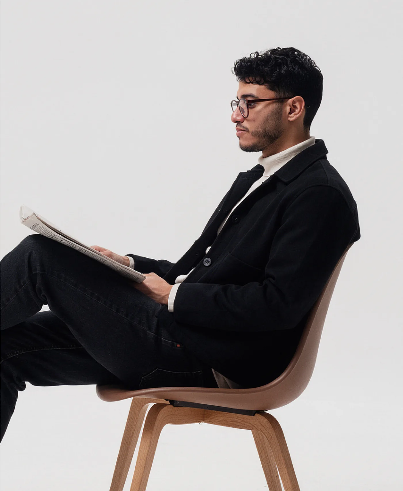 Ahmed Hazem, seated, reading